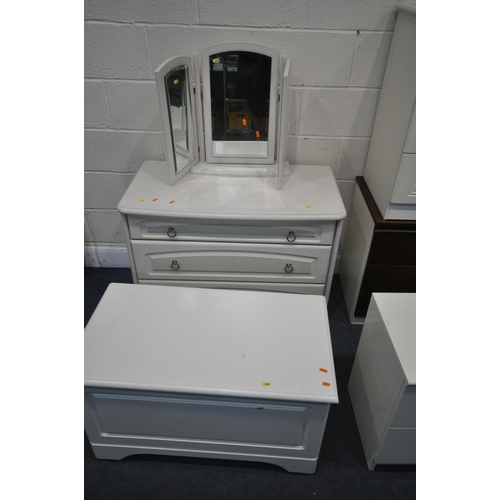 1244 - A MODERN THREE PIECE BEDROOM SUITE, comprising a dressing table, and a pair of two drawer bedside ca... 