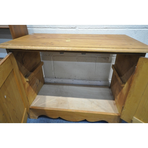 1250 - A PINE TWO DOOR CABINET, width 76cm x depth 41cm x height 58cm, along with a slim bookcase (conditio... 