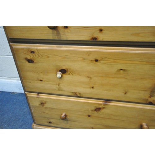 1259 - A DUCAL PINE DRESSER, the top with two glazed doors, flanking a central shelving section, the base w... 