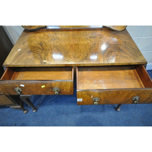 1263 - AN EARLY TO MID 20TH CENTURY WALNUT DRESSING TABLE, with a triple swing mirror, four various drawers... 