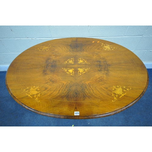 1273 - A VICTORIAN WALNUT AND MARQUETRY INLAID OVAL TILT TOP LOO TABLE, with four foliate carved legs, leng... 