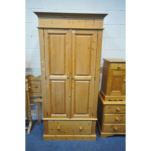 1275 - A PINE DOUBLE DOOR WARDROBE, with a single drawer to base, width 97cm x depth 61cm x height 200cm, a... 