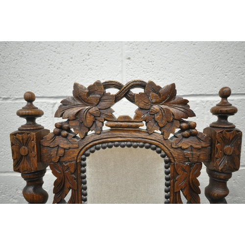 1277 - A SET OF SIX EARLY 20TH CENTURY FRENCH GOTHIC REVIVAL CHAIRS, with foliate carving to backrest, barl... 