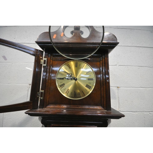 1295 - A MODERN MAHOGANY GRANDFATHER CLOCK, with a brassed ten inch dial, with Roman numerals, the top sect... 