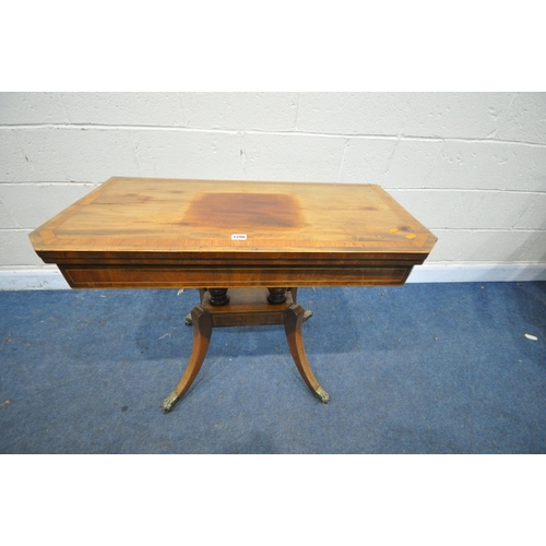 1296 - A DISTRESSED GEORGIAN WALNUT FOLD OVER GAMES TABLE, on twin turned supports, on splayed legs and bra... 