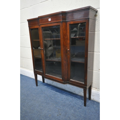 1301 - A SLIM MAHOGANY THREE DOOR GLAZED BREAKFRONT BOOKCASE, on square tapered legs, stamped old times fur... 