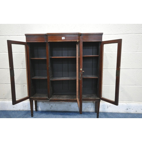 1301 - A SLIM MAHOGANY THREE DOOR GLAZED BREAKFRONT BOOKCASE, on square tapered legs, stamped old times fur... 