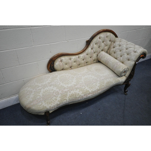 1327 - A VICTORIAN WALNUT CHAISE LOUNGE, with scrolled arm and shaped back, with foliate decoration, on cab... 