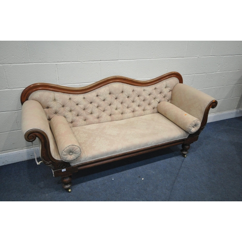 1328 - A VICTORIAN WALNUT THREE SEATER SOFA, with a shaped back, scrolled armrests, on turned legs and bras... 