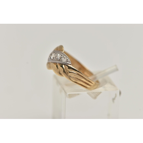 32 - A 9CT GOLD CUBIC ZIRCONIA SET RING, designed with an asymmetrical row of graduated colourless, cubic... 