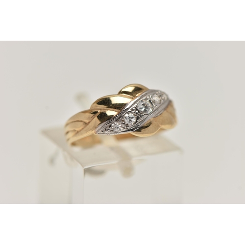 32 - A 9CT GOLD CUBIC ZIRCONIA SET RING, designed with an asymmetrical row of graduated colourless, cubic... 