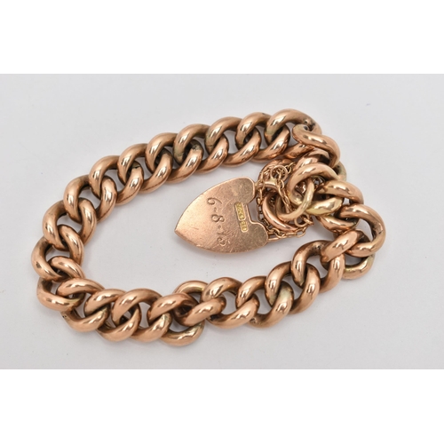 67 - A ROSE METAL CURB LINK BRACELET, hollow links, fitted with a heart padlock clasp, stamped 9ct, engra... 