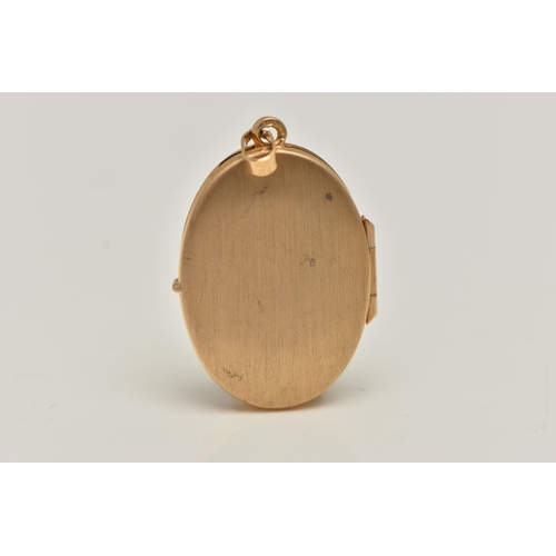 7 - A 9CT GOLD LOCKET, oval form decorated with a floral pattern, hallmarked 9ct Birmingham import, fitt... 