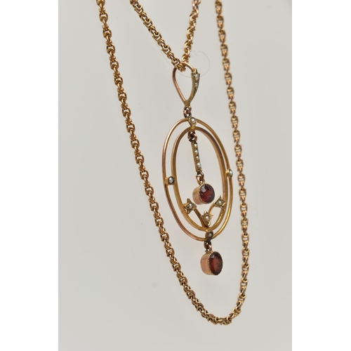 73 - A YELLOW METAL LAVALIER PENDANT AND CHAIN, oval openwork pendant set with garnets and split pearls, ... 