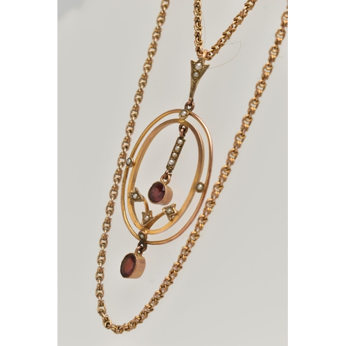 73 - A YELLOW METAL LAVALIER PENDANT AND CHAIN, oval openwork pendant set with garnets and split pearls, ... 