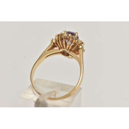 76 - A AMETHYST AND DIAMOND CLUSTER RING, principally set with an oval cut amethyst, ten round brilliant ... 