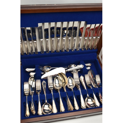 107 - TWO CANTEENS OF CUTLERY, the first an eight place canteen, signed 'Sheffield Cutlery England', dark ... 