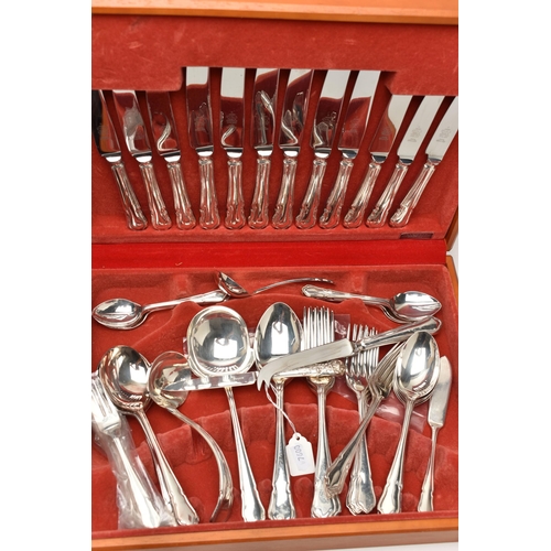 107 - TWO CANTEENS OF CUTLERY, the first an eight place canteen, signed 'Sheffield Cutlery England', dark ... 