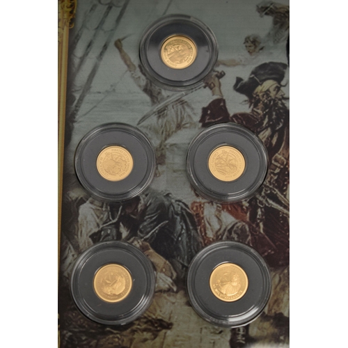 117 - A BOXED SMALL GOLD COIN COLLECTION OF 12 X 0.5 gram, Ivory coast proof coins   Pirates of the Seven ... 