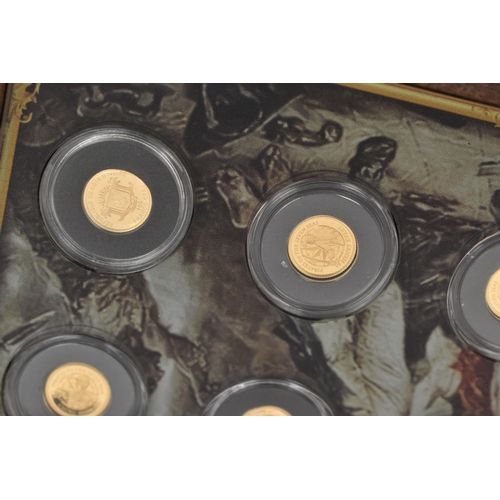 117 - A BOXED SMALL GOLD COIN COLLECTION OF 12 X 0.5 gram, Ivory coast proof coins   Pirates of the Seven ... 