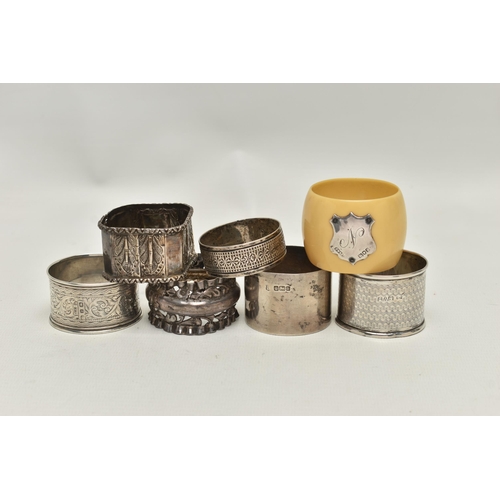 161 - AN ASSORTMENT OF SILVER AND WHITE METAL NAPKIN RINGS, five silver napkin rings varying in design, al... 