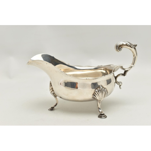 164 - A LATE VICTORIAN SILVER GRAVY BOAT,  polished form with engraved monogram and dated 1934-1959, wavy ... 