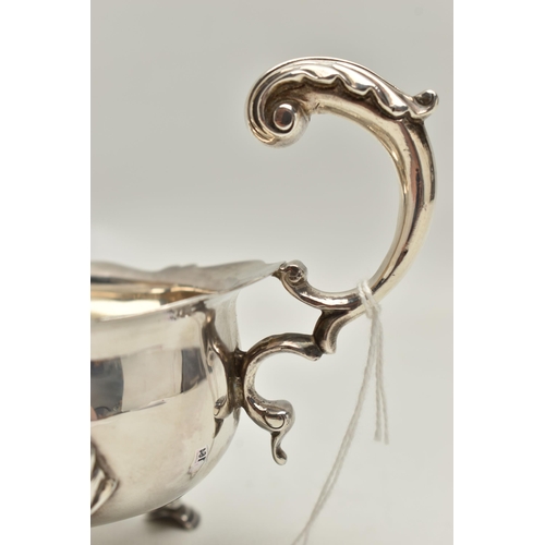 164 - A LATE VICTORIAN SILVER GRAVY BOAT,  polished form with engraved monogram and dated 1934-1959, wavy ... 