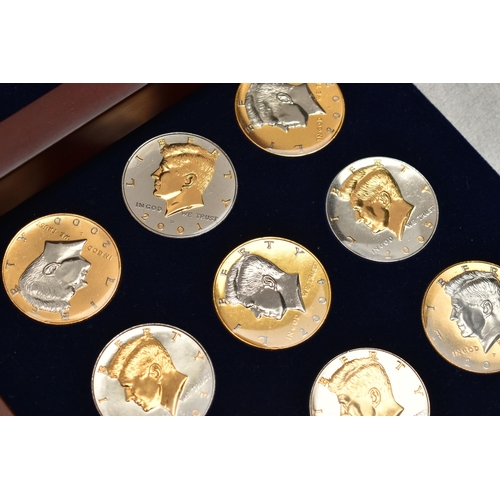 172 - A GLAZED BOXED SET OF ENHANCED KENNEDY HALF DOLLAR COINS, to include gold highlighted with uncircula... 