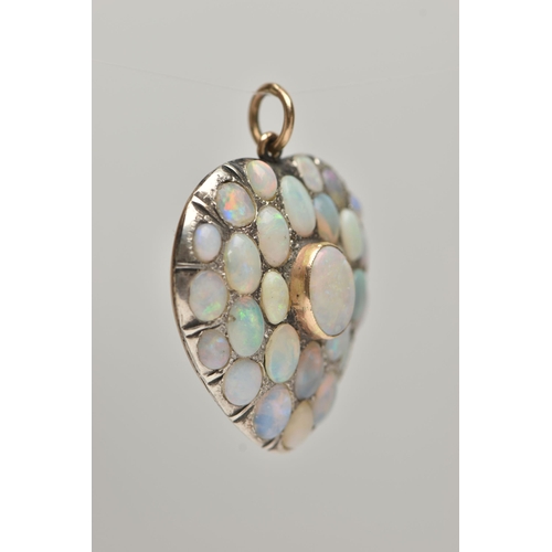 84 - AN EARLY 20TH CENTURY HEART SHAPE OPAL CABOCHON PENDANT, set with mainly oval shape opals, length 3.... 