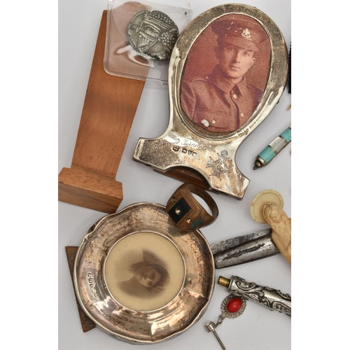 89 - A SMALL BOX OF ITEMS, to include two silver miniature photo frames, both with full silver hallmarks ... 