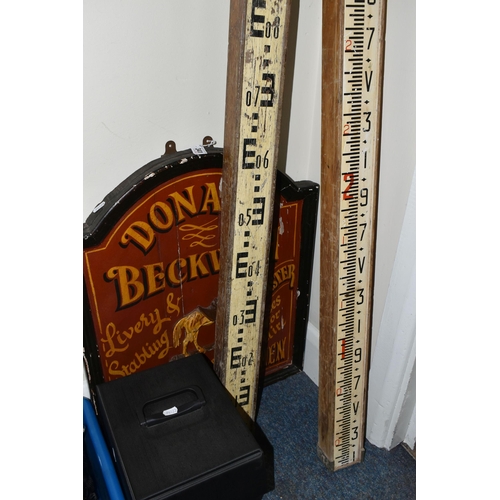 341 - TWO VINTAGE INVERTED SURVEYOR'S MEASURES, together with a reproduction wooden sign, two vintage car ... 