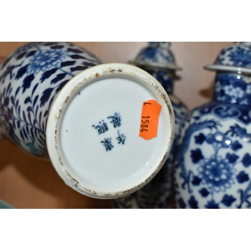 359 - A NEAR SET OF THREE 19TH CENTURY CHINESE BLUE AND WHITE PORCELAIN BALUSTER VASES WITH MATCHED COVERS... 