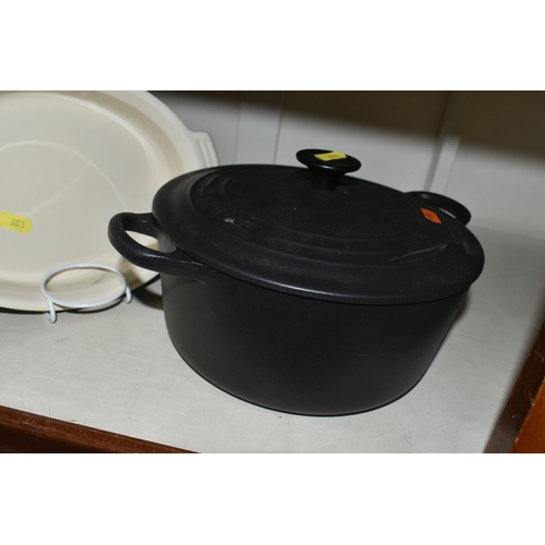 383 - THREE PIECES OF LE CREUSET AND SIMILAR COOKWARES, comprising a black cast iron Le Creuset 22cm casse... 