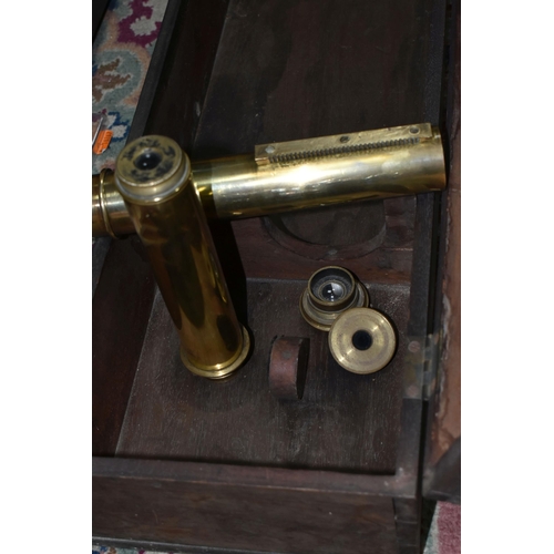 424 - A LARGE BRASS VICTORIAN TELESCOPE ON A WOODEN TRIPOD STAND, with a wooden case and three lens, heigh... 