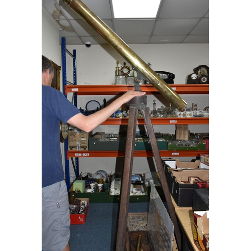 424 - A LARGE BRASS VICTORIAN TELESCOPE ON A WOODEN TRIPOD STAND, with a wooden case and three lens, heigh... 