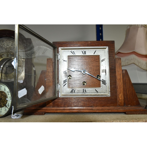 451 - TWO CLOCKS TOGETHER WITH CLOCK PARTS, comprising an Art Deco circular wooden clock (missing base), a... 