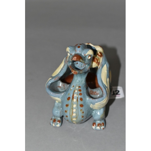 382 - A C.H BRANNAN POTTERY 'GRIFFIN' CANDLE/SPILL HOLDER, incised CH Brannam, Barum, dated 1894, slip gla... 