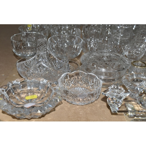 501 - A GROUP OF CUT CRYSTAL AND A SWAROVSKI FIVE POINT CANDLE HOLDER, comprising six grapefruit dishes (o... 