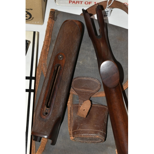 513 - A WALNUT FOREND AND GUN STOCK WITH A BISLEY CANVAS AND LEATHER TRIMMED SLIP, the forend stamped 791 ... 