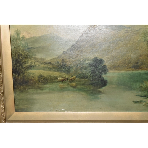 520 - T. LESLIE (19TH/20TH CENTURY) A RIVER LANDSCAPE, depicting a wide river with cattle drinking by the ... 