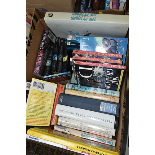 555 - SIX BOXES OF BOOKS, approximately one hundred and fifty hardback and paperback titles to include fic... 