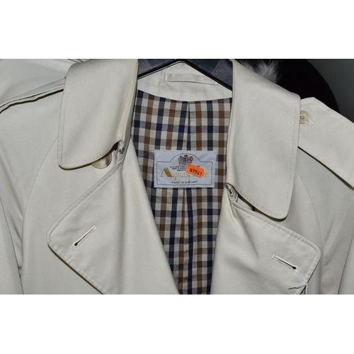 562 - A COLLECTION OF LADIES AND GENTS JACKETS, COATS AND HATS, comprising a ladies Aquascutum raincoat wi... 