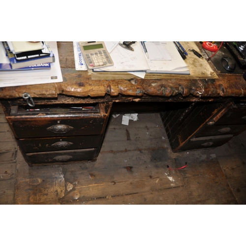 895 - AN EARLY 20th CENTURY KNEEHOLE DESK with three drawers eith side of kneehole solid pine top with rai... 