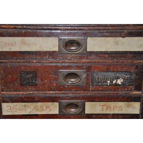 925 - AN EDWARDIAN MAHOGANY HARBERDASHERS CHEST OF TWENTY FOUR DRAWERS with campaign handles to all but on... 