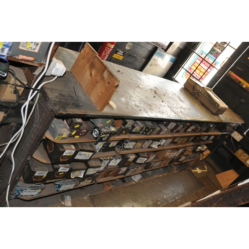 932 - AN EARLY 20th CENTURY SHOP COUNTER with panelled front, pine plant top, zink plate and Rabone and Ch... 