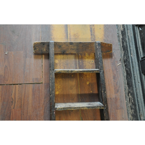 964 - AN EARLY 20th CENTURY SET OF PITCH PINE LIBRARY LADDERS with ten rungs, worn gently on front edge an... 