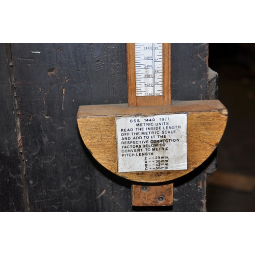 965 - A TBA CORD V BELT MEASURE with metric and Imperial scale, constructed from oak (this lot is located ... 