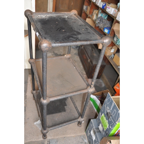 995 - AN EARLY 20th CENTURY CAST IRON AND SHEET STEEL THREE TIER WORKSHOP TABLE with black painted finish,... 