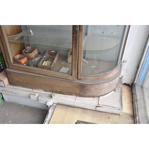 996 - A VICTORIAN SHOP DISPLAY CABINET with quarter round glazed end, straight glass door and flat mahogan... 