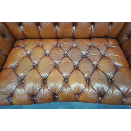 1323 - AN OSKAR TETRAD BUTTONED TANNED LEATHER CHESTERFIELD THREE SEATER SOFA, length 206cm x depth 107cm x... 